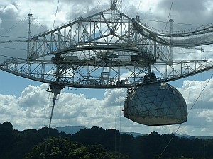 Million pounds of gear, suspended five hundred feet above the dish. 